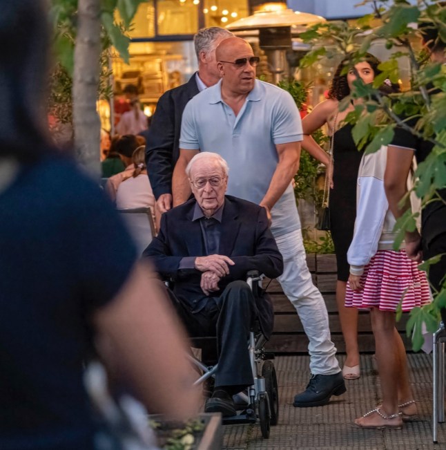 BGUK_3295080 - *PREMIUM-EXCLUSIVE* London, UNITED KINGDOM MUST CALL FOR PRICING BEFORE USAGE - Hollywood legends Michael Caine and Vin Diesel dined together with their families at the River Caf?? in Hammersmith, London, for an early birthday celebration - all captured as part of an upcoming documentary. Caine, 92, was pictured for the first time since transitioning from a Zimmer frame to a wheelchair and appeared in high spirits as Vin lovingly wheeled him around. The legendary actor, who sported a band-aid on his face, was joined by his wife Shakira, while Vin???s long-time partner Paloma Jim??nez and their two children were also present. Caine, who considers Vin his ???unofficial son,??? looked to be thoroughly enjoying himself during the two-hour meal, even singing Happy Birthday to the Fast & Furious star, who turns 58 next week. After the feast, Vin was seen rubbing his belly, clearly satisfied with the hearty celebration as this comes all ahead of Vin's jury trial for Sexual Battery starting next month August 18th with the Hollywood star's rep claimed there have been no cases against the actor for sexual misconduct or assault allegations, according to reports. *STRICTLY NO SUBSCRIPTIONS AND NO SOCIAL SOCIAL MEDIA USE* Pictured: Michael Caine, Vin Diesel, Shakira Caine, Paloma Jim??nez BACKGRID UK 9 JULY 2025 UK: +44 208 344 2007 / uksales@backgrid.com USA: +1 310 798 9111 / usasales@backgrid.com *Pictures Containing Children Please Pixelate Face Prior To Publication*