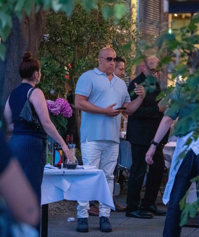 BGUK_3295080 - *PREMIUM-EXCLUSIVE* London, UNITED KINGDOM MUST CALL FOR PRICING BEFORE USAGE - Hollywood legends Michael Caine and Vin Diesel dined together with their families at the River Caf?? in Hammersmith, London, for an early birthday celebration - all captured as part of an upcoming documentary. Caine, 92, was pictured for the first time since transitioning from a Zimmer frame to a wheelchair and appeared in high spirits as Vin lovingly wheeled him around. The legendary actor, who sported a band-aid on his face, was joined by his wife Shakira, while Vin???s long-time partner Paloma Jim??nez and their two children were also present. Caine, who considers Vin his ???unofficial son,??? looked to be thoroughly enjoying himself during the two-hour meal, even singing Happy Birthday to the Fast & Furious star, who turns 58 next week. After the feast, Vin was seen rubbing his belly, clearly satisfied with the hearty celebration as this comes all ahead of Vin's jury trial for Sexual Battery starting next month August 18th with the Hollywood star's rep claimed there have been no cases against the actor for sexual misconduct or assault allegations, according to reports. *STRICTLY NO SUBSCRIPTIONS AND NO SOCIAL SOCIAL MEDIA USE* Pictured: Michael Caine, Vin Diesel, Shakira Caine, Paloma Jim??nez BACKGRID UK 9 JULY 2025 UK: +44 208 344 2007 / uksales@backgrid.com USA: +1 310 798 9111 / usasales@backgrid.com *Pictures Containing Children Please Pixelate Face Prior To Publication*