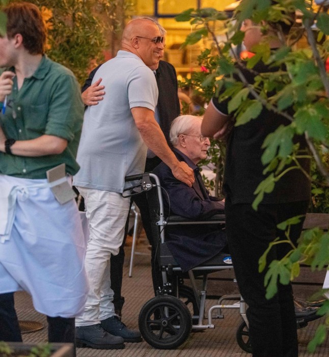 BGUK_3295080 - *PREMIUM-EXCLUSIVE* London, UNITED KINGDOM MUST CALL FOR PRICING BEFORE USAGE - Hollywood legends Michael Caine and Vin Diesel dined together with their families at the River Caf?? in Hammersmith, London, for an early birthday celebration - all captured as part of an upcoming documentary. Caine, 92, was pictured for the first time since transitioning from a Zimmer frame to a wheelchair and appeared in high spirits as Vin lovingly wheeled him around. The legendary actor, who sported a band-aid on his face, was joined by his wife Shakira, while Vin???s long-time partner Paloma Jim??nez and their two children were also present. Caine, who considers Vin his ???unofficial son,??? looked to be thoroughly enjoying himself during the two-hour meal, even singing Happy Birthday to the Fast & Furious star, who turns 58 next week. After the feast, Vin was seen rubbing his belly, clearly satisfied with the hearty celebration as this comes all ahead of Vin's jury trial for Sexual Battery starting next month August 18th with the Hollywood star's rep claimed there have been no cases against the actor for sexual misconduct or assault allegations, according to reports. *STRICTLY NO SUBSCRIPTIONS AND NO SOCIAL SOCIAL MEDIA USE* Pictured: Michael Caine, Vin Diesel, Shakira Caine, Paloma Jim??nez BACKGRID UK 9 JULY 2025 UK: +44 208 344 2007 / uksales@backgrid.com USA: +1 310 798 9111 / usasales@backgrid.com *Pictures Containing Children Please Pixelate Face Prior To Publication*