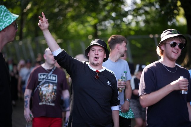MANCHESTER, ENGLAND - JULY 11: Oasis fans arrive at Heaton Park for the first show in the hometown of Liam and Noel Gallagher on July 11, 2025 in Manchester, England. Oasis are playing a run of five sold-out shows to their hometown fans at Heaton Park in Manchester, between July 11-20. The rock band kicked off a 41-date reunion tour in Cardiff last week, with brothers Liam and Noel Gallagher reuniting for their first performances together since their dramatic split in 2009. (Photo by Christopher Furlong/Getty Images)