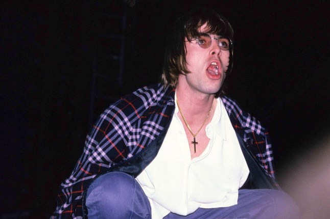 Singer Liam Gallagher performing with British rock group Oasis on the first of two nights at Maine Road stadium, Manchester, 27th April 1996. (Photo by Fred Duval/FilmMagic)