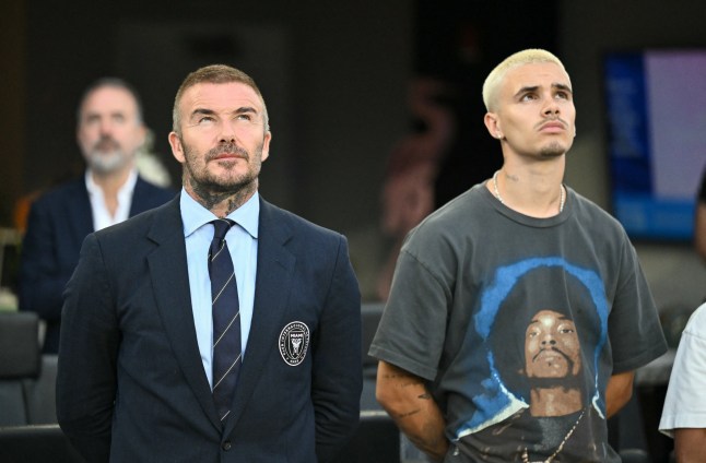 Inter Miami's co-owner David Beckham and his son Romeo James Beckham stand for the National Anthem before the Major League Soccer (MLS) regular season soccer match between Inter Miami CF and Nashville SC at Chase Stadium in Fort Lauderdale, Florida on July 12, 2025. (Photo by Chandan Khanna / AFP) (Photo by CHANDAN KHANNA/AFP via Getty Images)