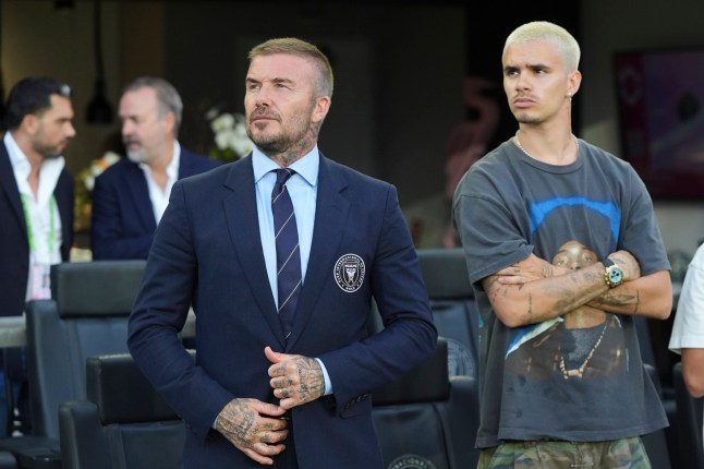 Inter Miami co-owner David Beckham, left, stands with his son Romeo, right, before an MLS soccer match between Inter Miami and Nashville SC, Saturday, July 12, 2025, in Fort Lauderdale, Fla. (AP Photo/Lynne Sladky)