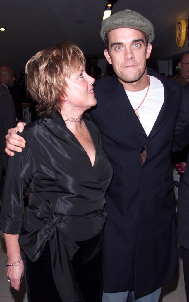 LONDON - DECEMBER 6: British pop star Robbie Williams and his mother arrive at the premiere of the film "Nobody Someday" at Warner Brothers Cinema, Sheperds Bush on December 6, 2001 in London. (Photo by Dave Hogan/Getty Images)