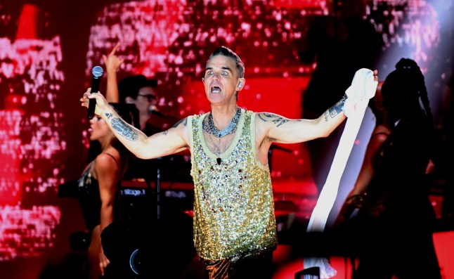 SANDRINGHAM, NORFOLK - AUGUST 26: Robbie Williams performs on stage during Heritage Live 2023 at Royal Sandringham Estate on August 26, 2023 in Sandringham, Norfolk. (Photo by Gus Stewart/Redferns)