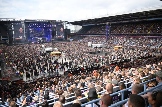 The Villa Park crowd watch support acts, during British rock band Black Sabbath's "Back to The Beginning" concert, Ozzy Osbourne's final ever gig as Black Sabbath's frontman at Villa Park in Birmingham, central England on July 5, 2025. Osbourne, who revealed in 2020 that he has Parkinson's disease, will join Tony Iommi, Geezer Butler and Bill Ward for the all-day "Back To The Beginning" show in Birmingham, central England, where the heavy metal giants formed in 1968. (Photo by ANDY BUCHANAN / AFP) (Photo by ANDY BUCHANAN/AFP via Getty Images)