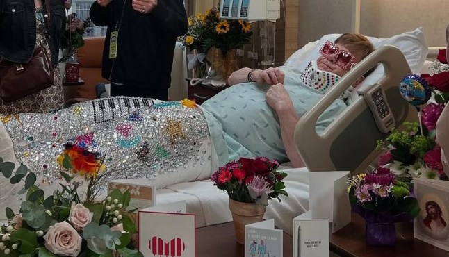 Elton John in a hospital bed.