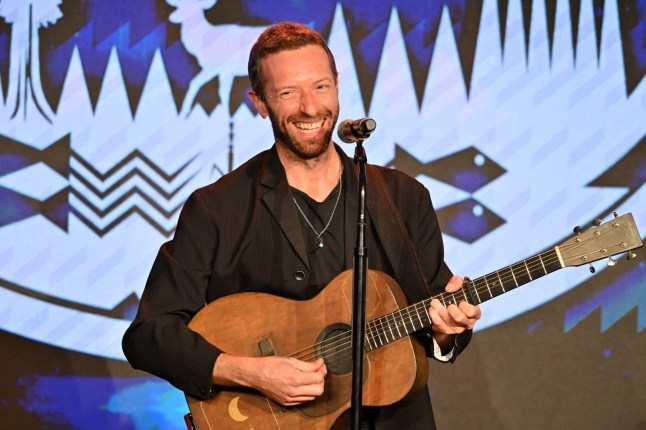 English singer-songwriter Chris Martin performs on stage at the Sierra Club's 2025 Trail Blazers Ball at the Skirball Cultural Center in Los Angeles on April 2, 2025. (Photo by Robyn Beck / AFP) (Photo by ROBYN BECK/AFP via Getty Images)