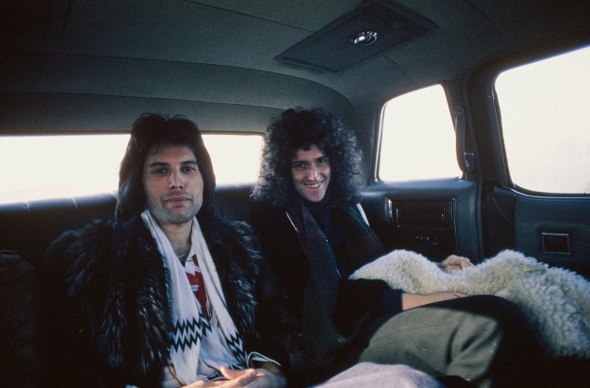 Freddie Mercury and Brian May sat together in the back of a taxi in 1977.