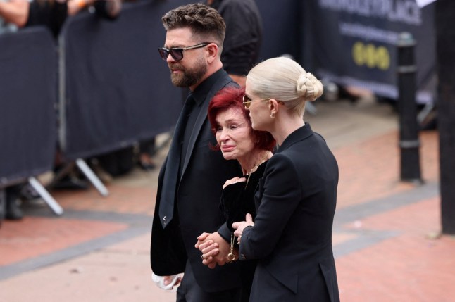 Sharon Osbourne, Kelly Osbourne and Jack Osbourne walk as people gather for the funeral cortege of Ozzy Osbourne, the former Black Sabbath frontman, in Birmingham, Britain, July 30, 2025. REUTERS/Jack Taylor