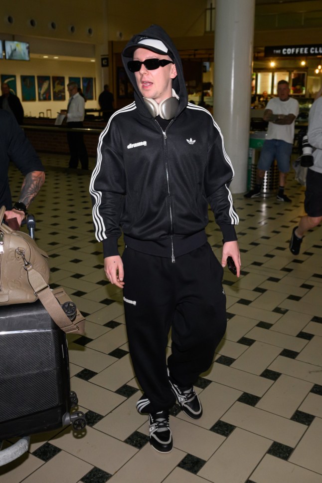 Mandatory Credit: Photo by James Gourley/Shutterstock (15725538l) Aitch 'I'm a Celebrity...Get Me Out of Here!' TV show, Series 25, Arrivals, Brisbane Airport, Australia - 10 Nov 2025