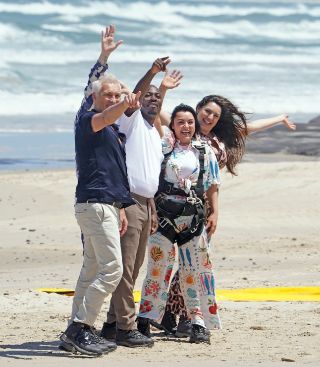Im a celebrity get Me Out Of Here 2025 Kelly Brook, Shona McCarty, Eddie Kadi, Martin Kemp and Aitch parachute onto Evans head beach today with Ant and Dec watching from what looks like a castle