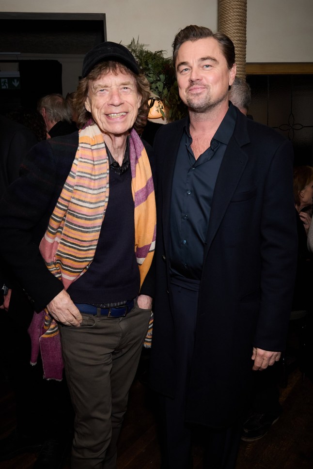 LONDON, ENGLAND - NOVEMBER 20: Mick Jagger and Leonardo DiCaprio attend a celebration of One Battle After Another with Paul Thomas Anderson and Leonardo DiCaprio at The Hart Pub, London on November 20, 2025 in London, England. (Photo by Darren Gerrish/WireImage for Warner Bros Pictures)