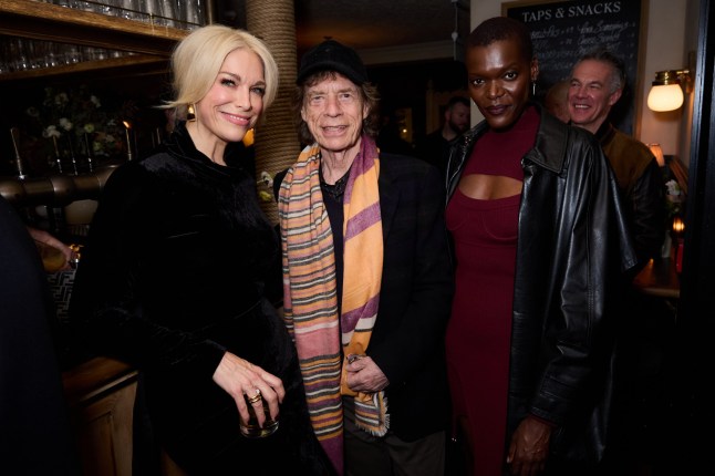 LONDON, ENGLAND - NOVEMBER 20: (L-R) Hannah Waddingham, Mick Jagger and Sheila Atim attend a celebration of One Battle After Another with Paul Thomas Anderson and Leonardo DiCaprio at The Hart Pub, London on November 20, 2025 in London, England. (Photo by Darren Gerrish/WireImage for Warner Bros Pictures)