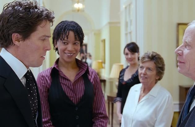 Hugh Grant, Martine McCutcheon, Frank Moorey, Jill Freud, and Nina Sosanya in Love Actually (2003) Picture: Universal