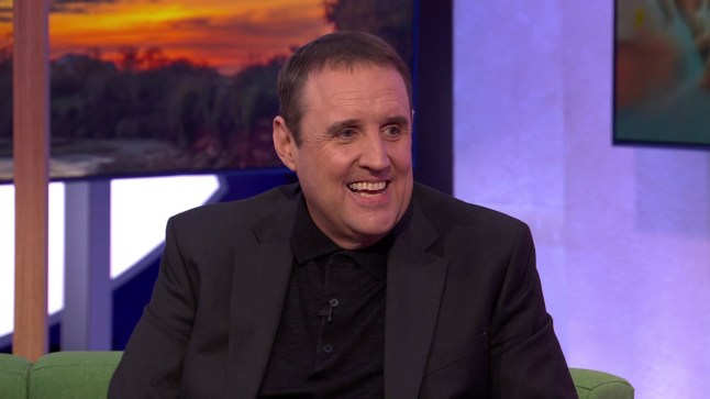 Peter Kay smiling and speaking on The One Show.